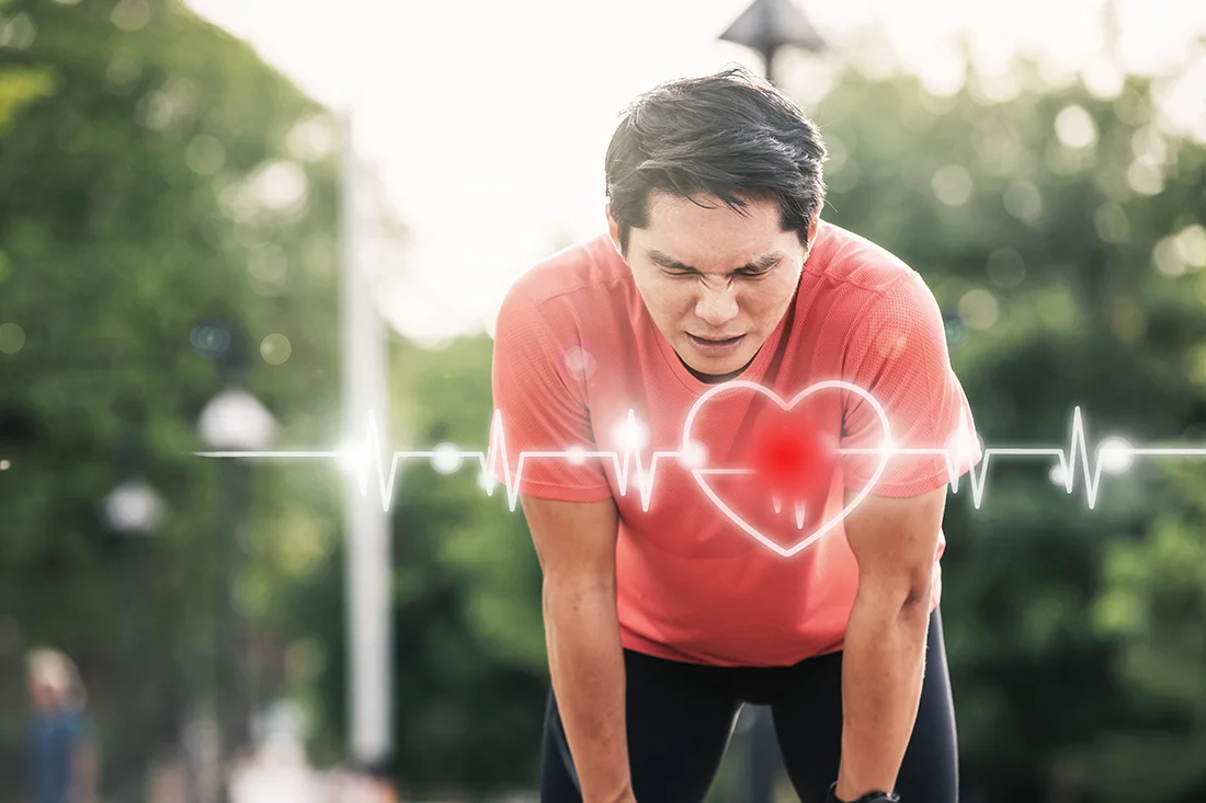 Man runner athlete chest injury and pain sport man having chest pain after running in the park , heart attack Asian cardiac arrest running young man heart attack in park