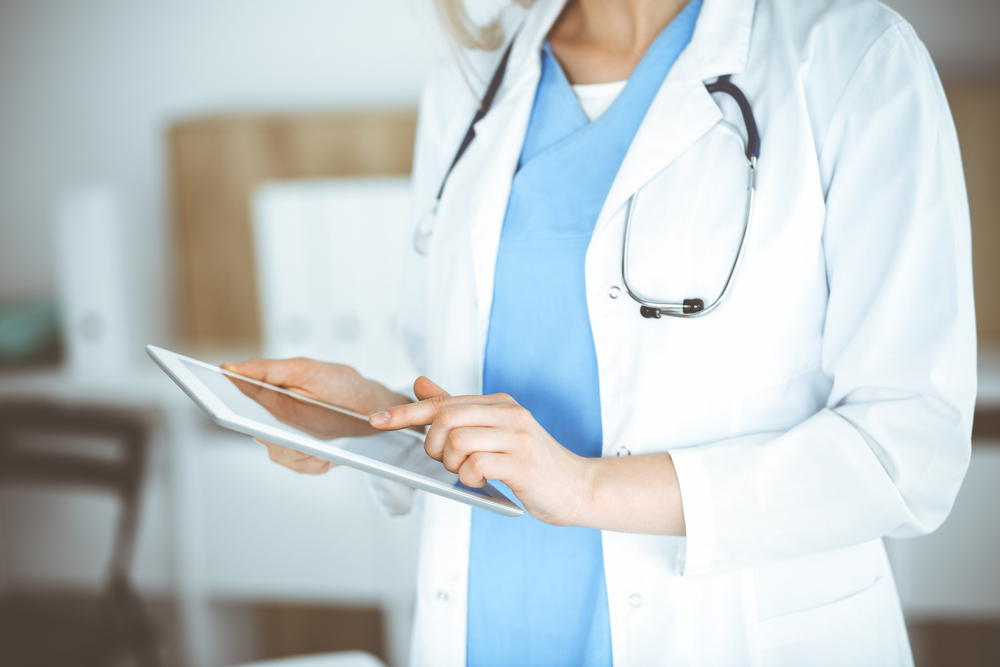 Woman Looking at Tablet
